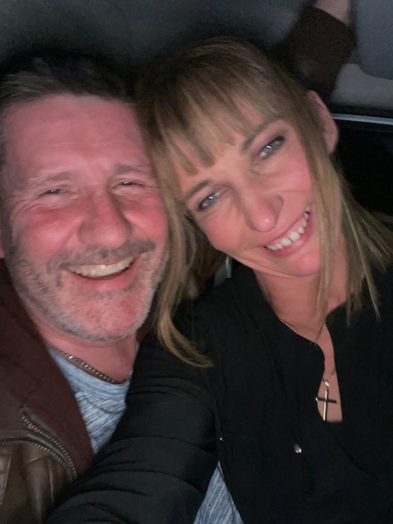 A candid photo of me and my husband Blod,  smiling together.